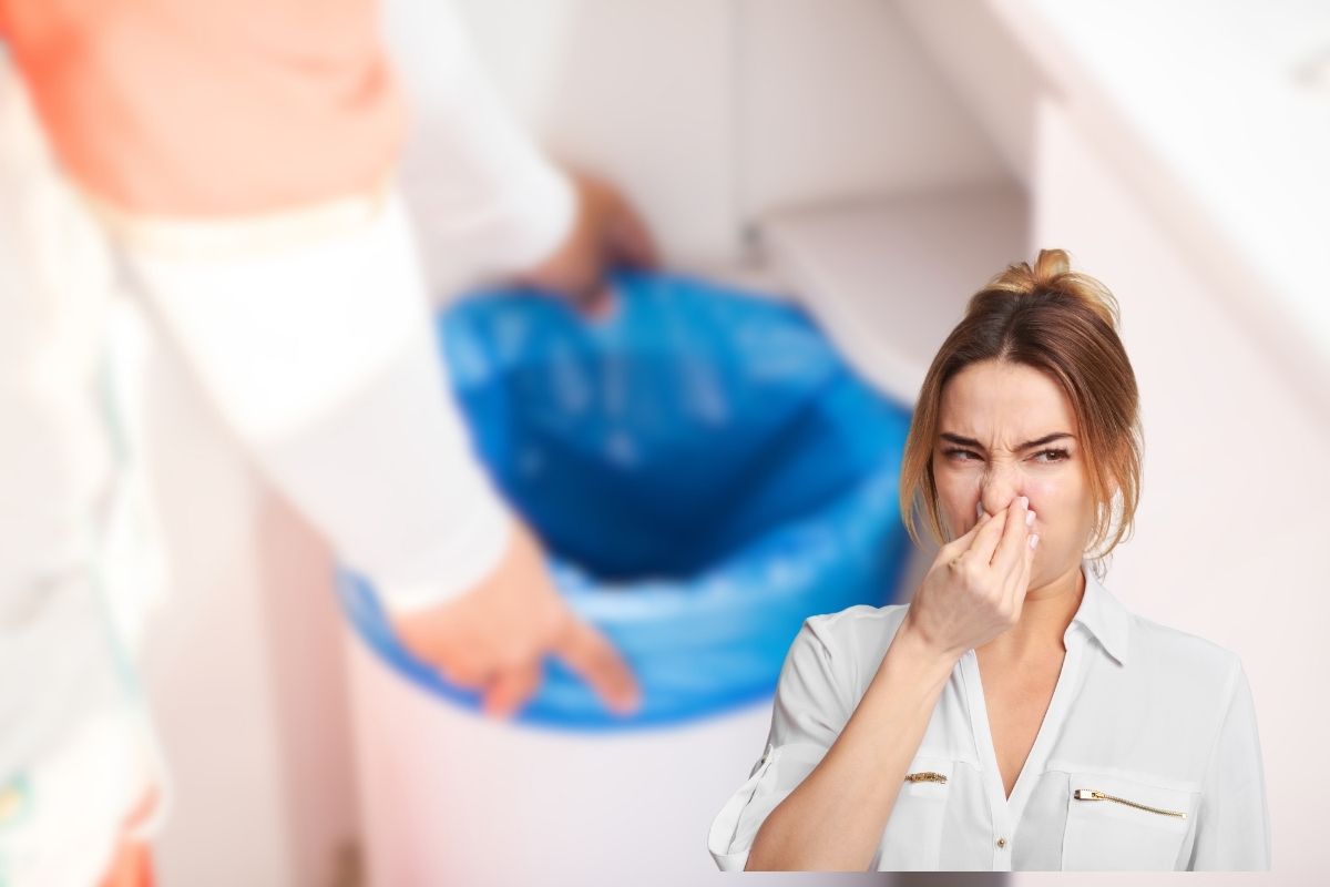 donna con bidone spazzatura in mano e cattivi odori